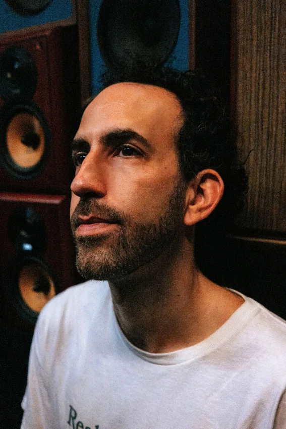 Ben Gomori portrait beside a loudspeaker