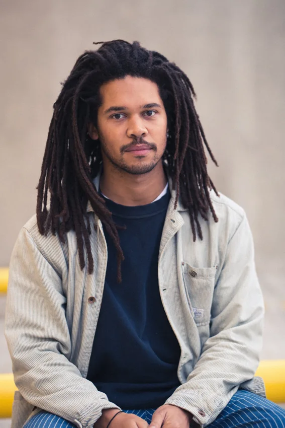 Bradley Zero seated for a promotional portrait