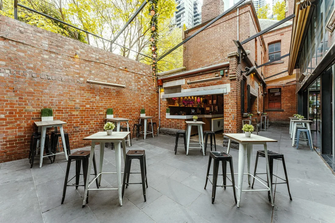 Bourke Street Courtyard brick-walled courtyard with high tables and corner bar