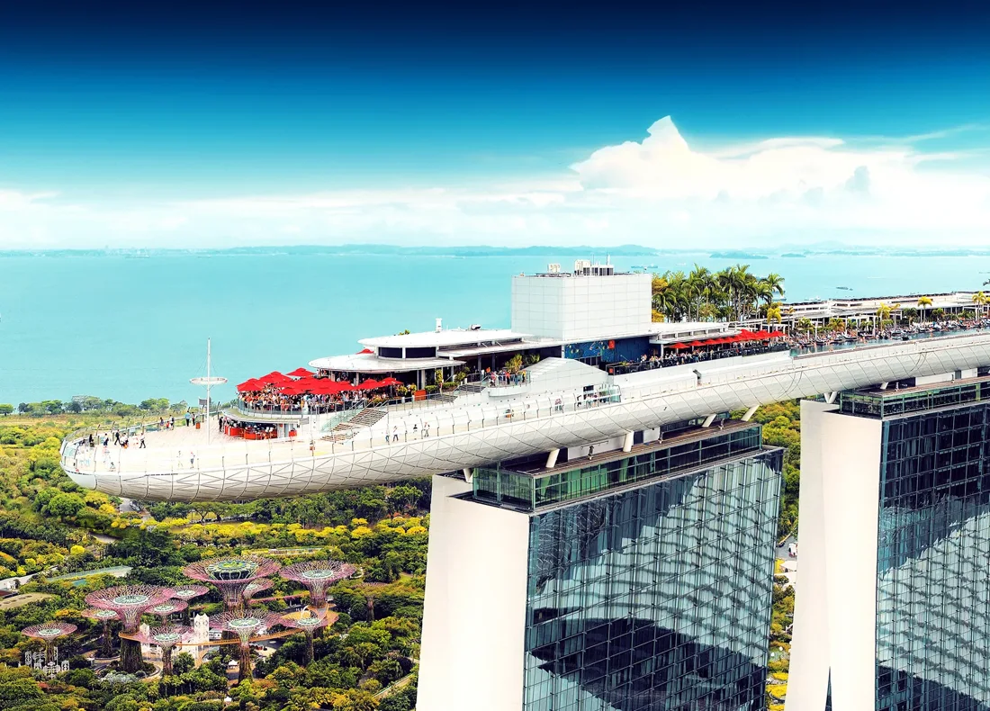 CÉ LA VI aerial of the SkyPark rooftop deck with red umbrellas