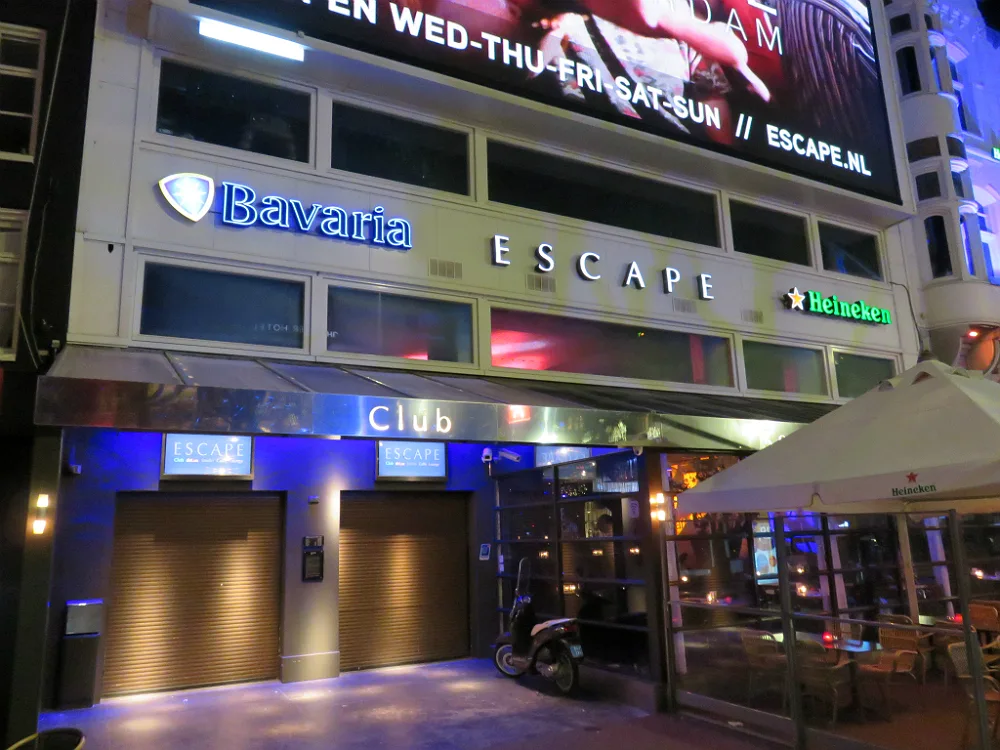 Escape nightclub facade at night with illuminated signage on Rembrandtplein