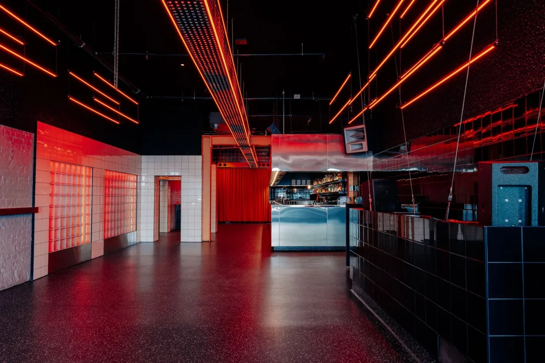 Glamorama empty main room with red neon ceiling strips and long bar