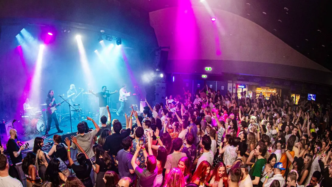 Concert audience and band inside Manning Bar