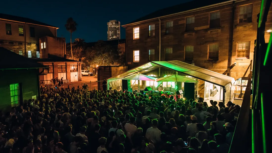 Summer Dance audience and illuminated DJ stage in the National Art School courtyard