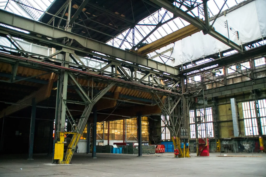 NDSM Scheepsbouwloods empty steel-framed shipbuilding hall under a glass roof