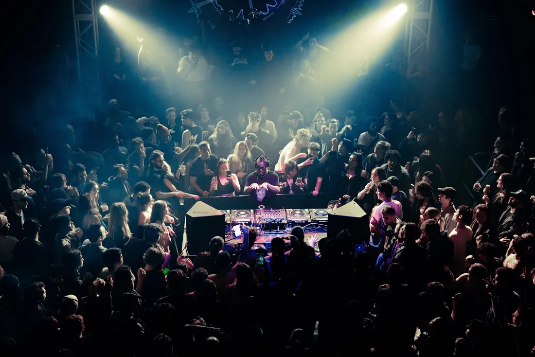 A DJ surrounded by dancers inside SILO Brooklyn