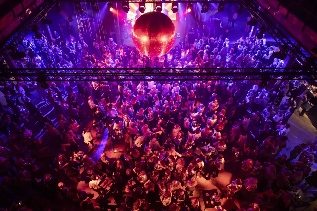 SugarFactory packed dancefloor under a giant mirror ball, seen from above