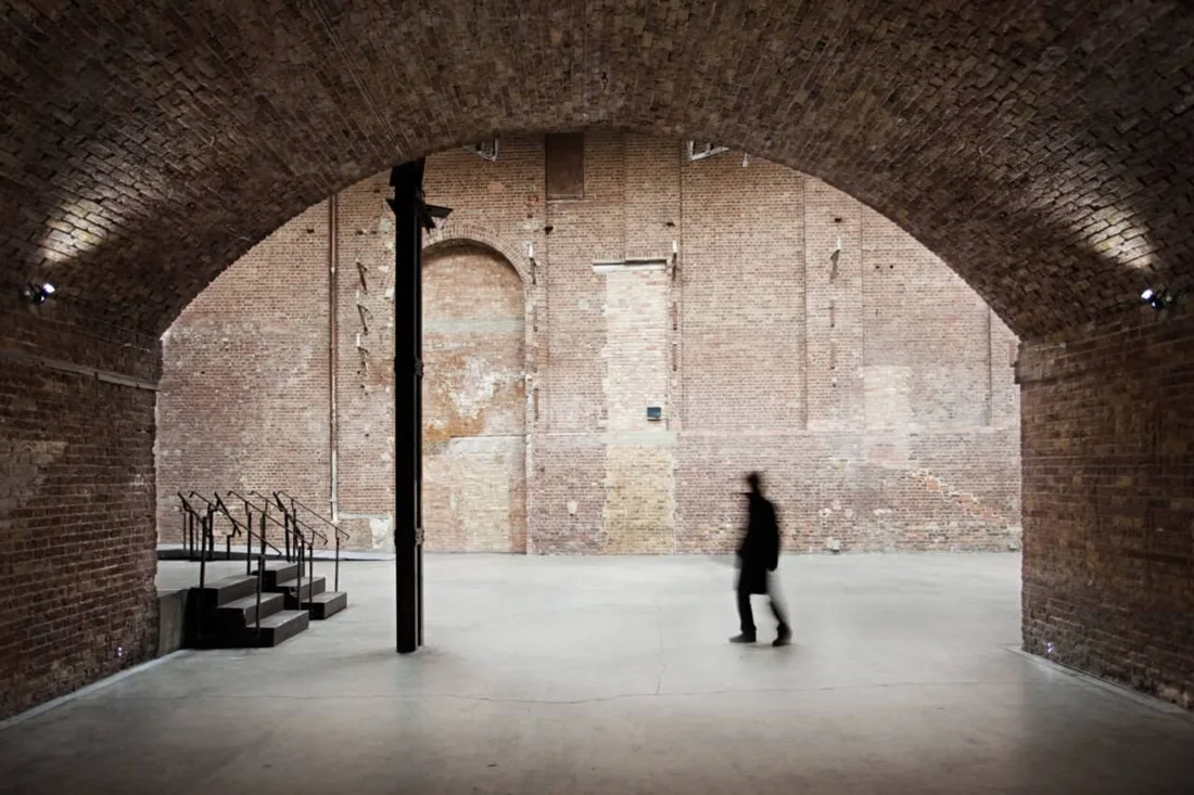 Village Underground empty brick-arched main hall with iron column and steps