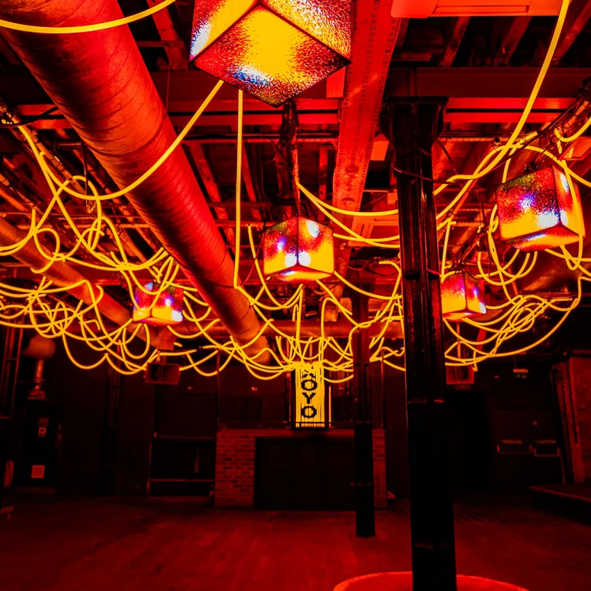 XOYO Basement dancefloor under looping neon tubes, XOYO banner at back