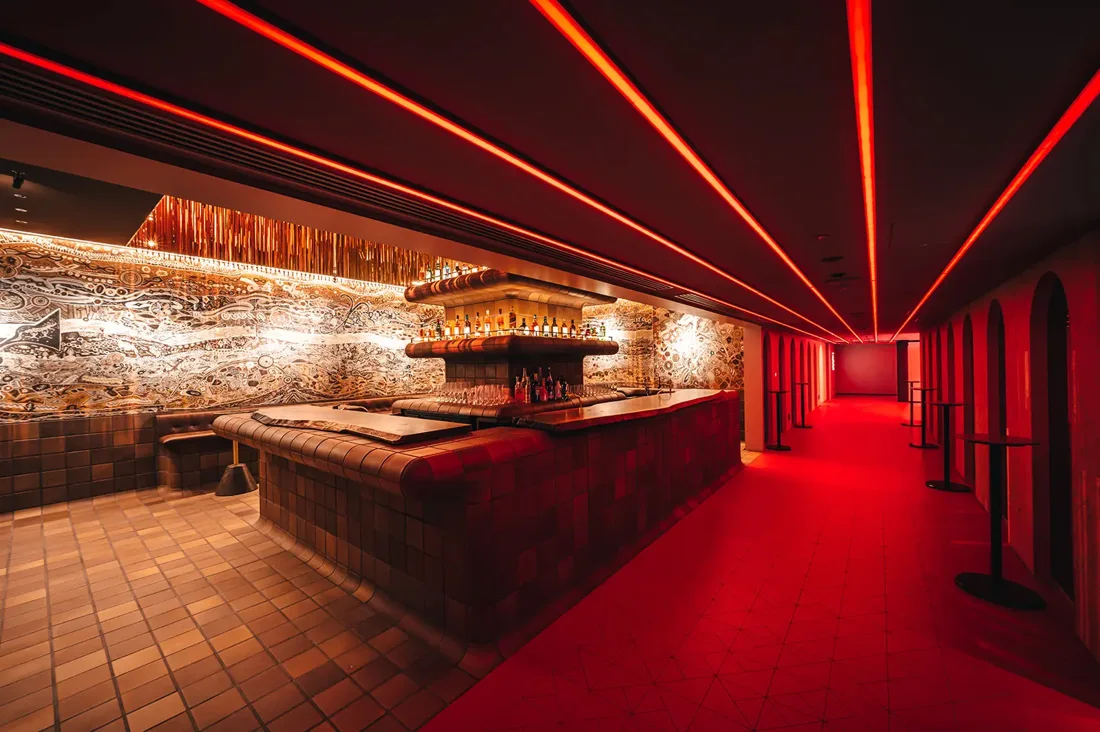 ZEROTOKYO bar lounge with red LED ceiling lines and patterned wall